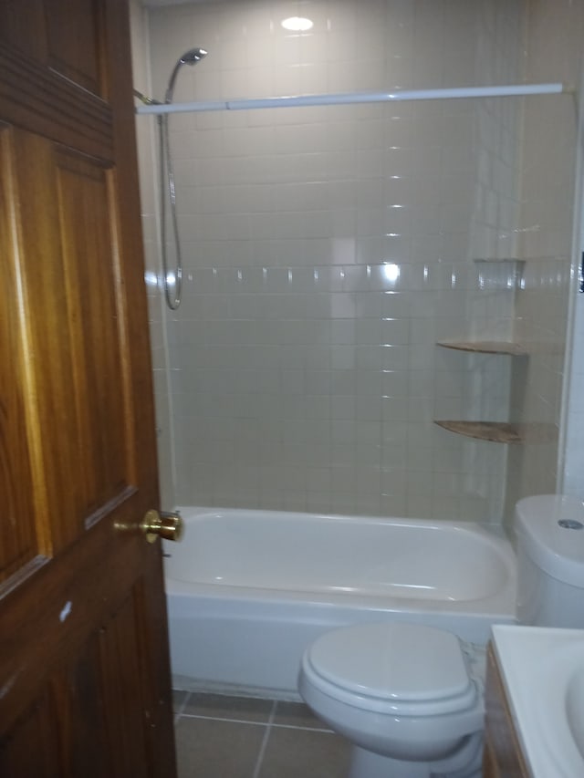 full bathroom featuring tile patterned flooring, vanity, washtub / shower combination, and toilet