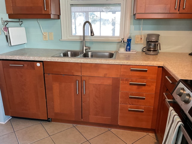 kitchen with electric stove, sink, dishwasher, and light tile patterned flooring