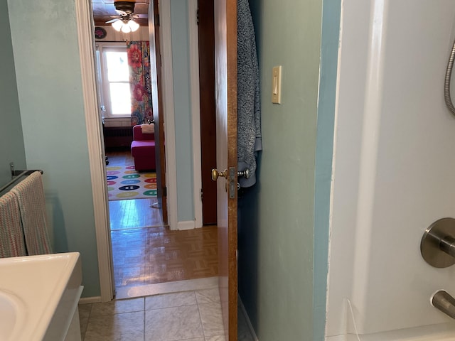 hallway with light tile patterned floors