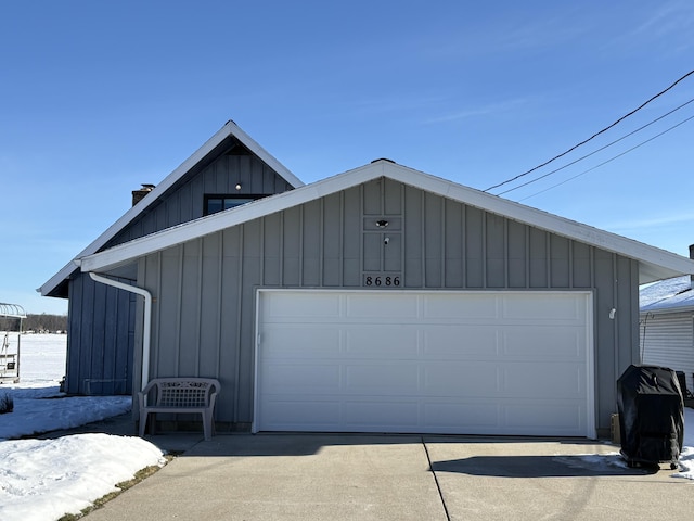 view of snow covered garage