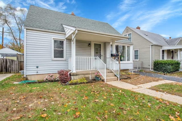 bungalow with a front yard