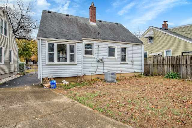 back of property with central AC unit