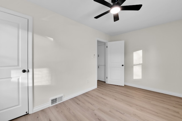 spare room featuring ceiling fan and light hardwood / wood-style flooring