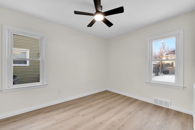 empty room featuring light hardwood / wood-style floors and ceiling fan