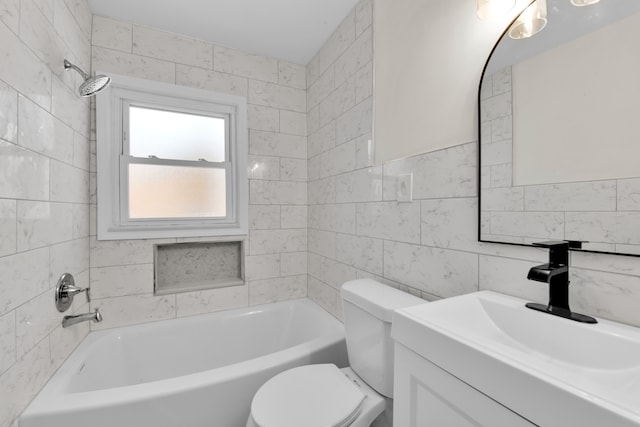 full bathroom featuring tile walls, vanity, tiled shower / bath combo, and toilet