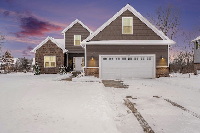 view of front of property with a garage