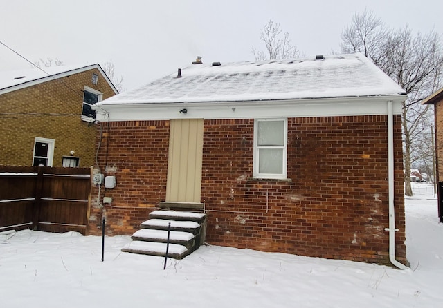 view of snow covered house