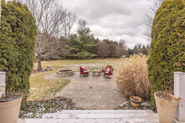 view of patio with a fire pit