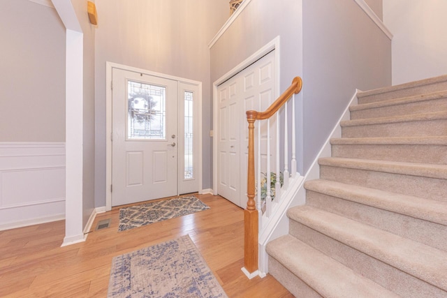 foyer entrance with light wood-type flooring