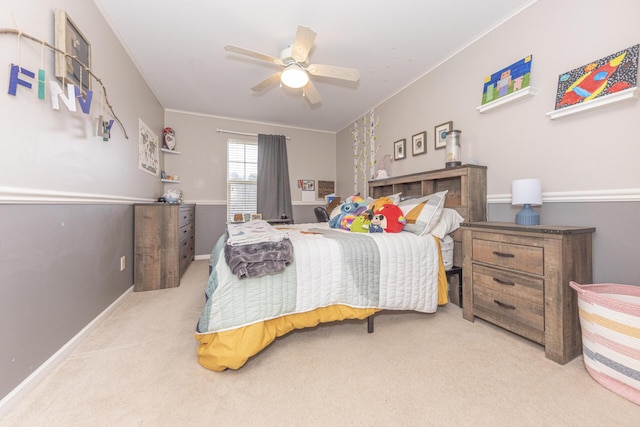 bedroom featuring crown molding, carpet flooring, and ceiling fan