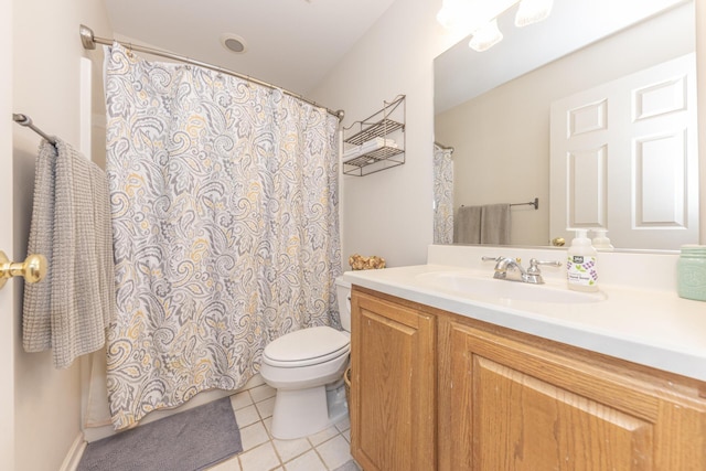 bathroom with vanity, toilet, and tile patterned flooring