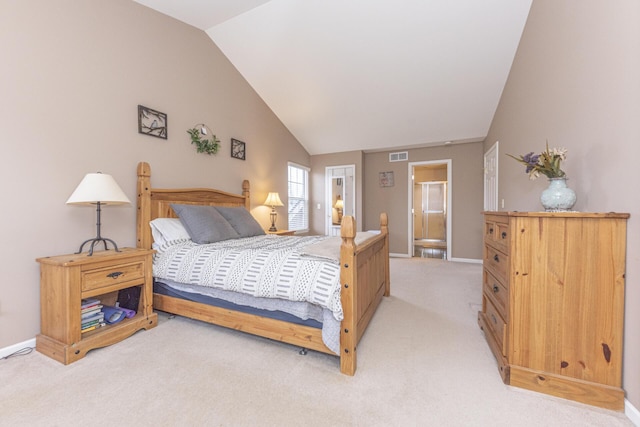 bedroom featuring light carpet and vaulted ceiling