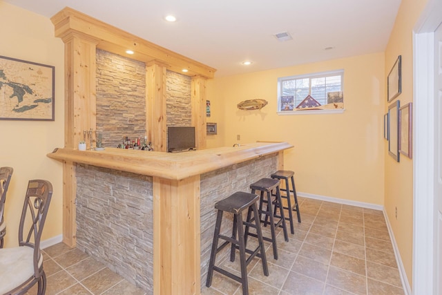 bar with tile patterned flooring