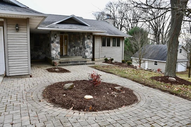 view of exterior entry featuring a garage