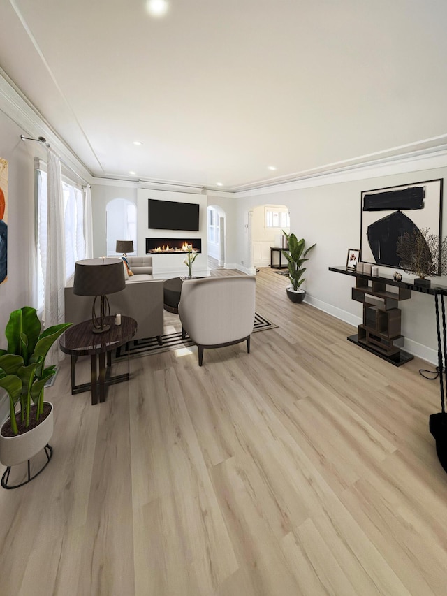 living room featuring crown molding and light wood-type flooring