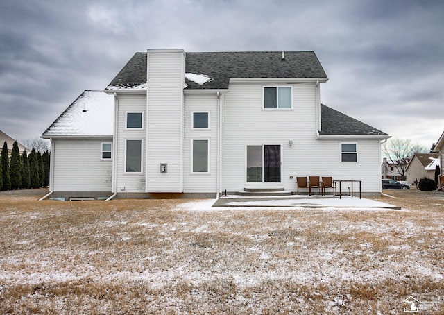 rear view of property featuring a patio