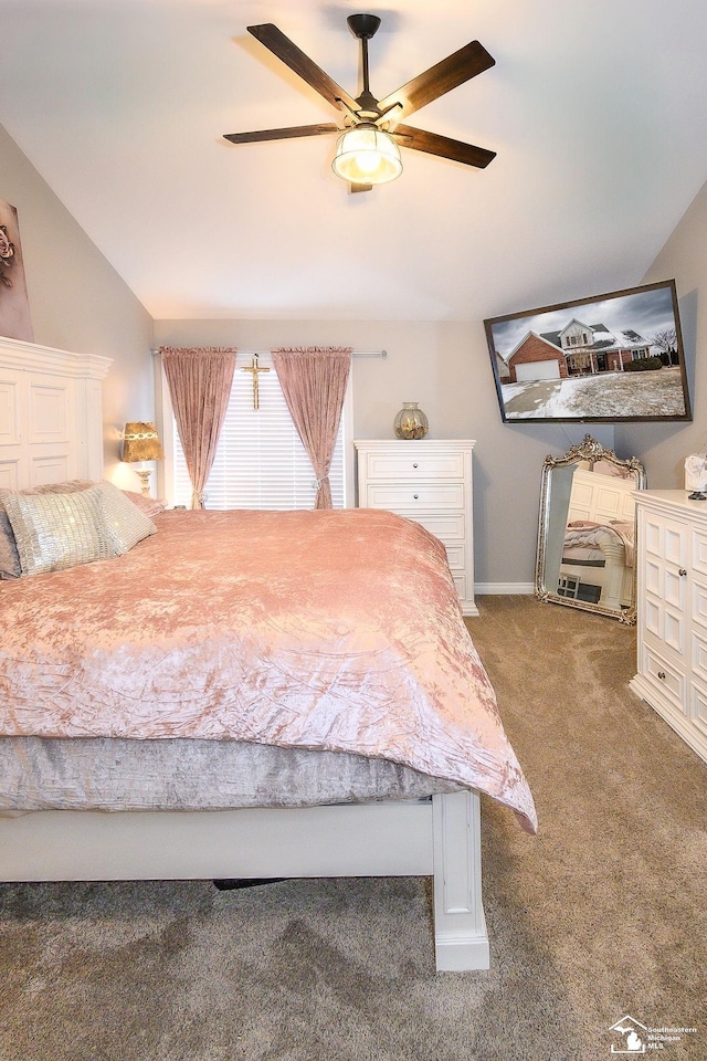 carpeted bedroom with lofted ceiling and ceiling fan