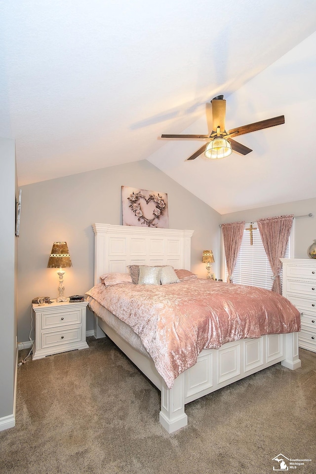 bedroom featuring vaulted ceiling, ceiling fan, and dark carpet