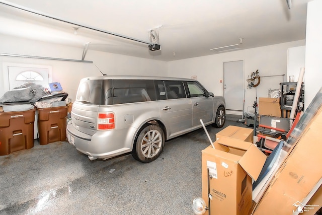 garage featuring a garage door opener