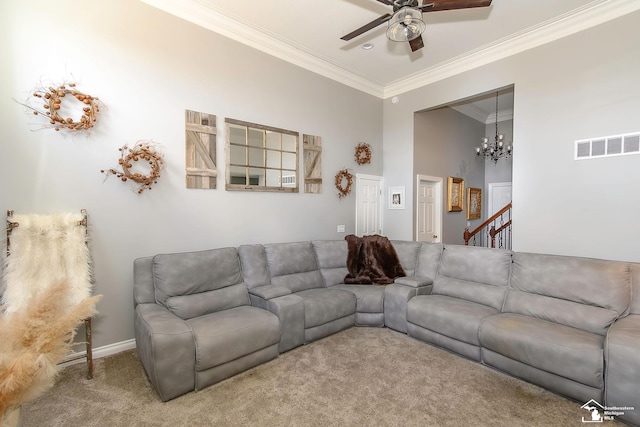 carpeted living room with crown molding and ceiling fan with notable chandelier