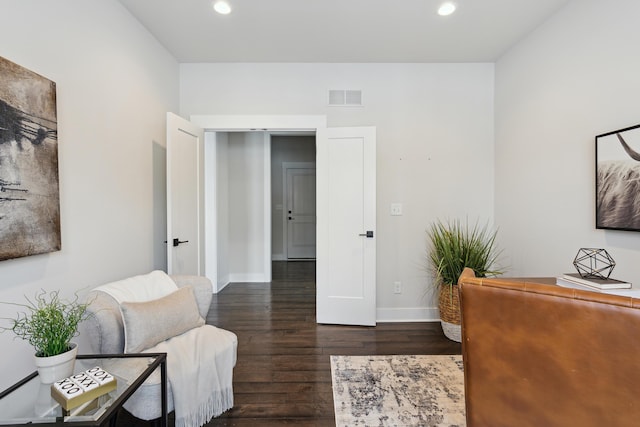 office space with dark wood-type flooring