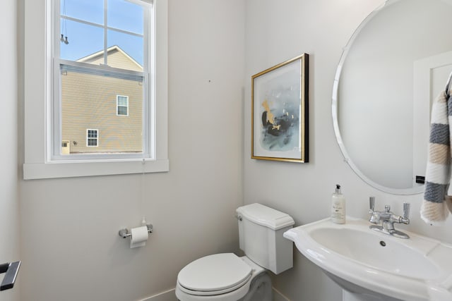 bathroom with toilet and sink