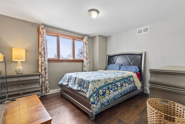 bedroom featuring dark hardwood / wood-style floors