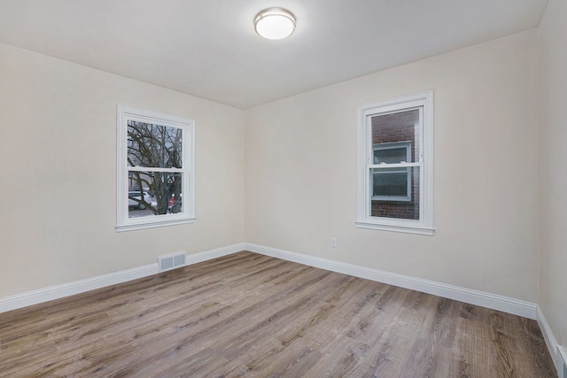 unfurnished room featuring light hardwood / wood-style floors