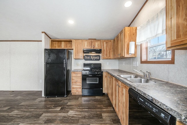 kitchen with dark wood-type flooring, ornamental molding, sink, and black appliances