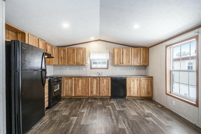 kitchen with vaulted ceiling, sink, dark hardwood / wood-style flooring, black appliances, and a textured ceiling