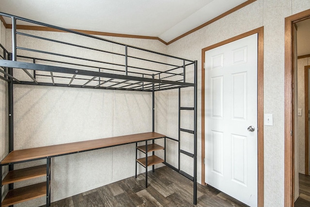 bedroom with lofted ceiling and dark hardwood / wood-style flooring