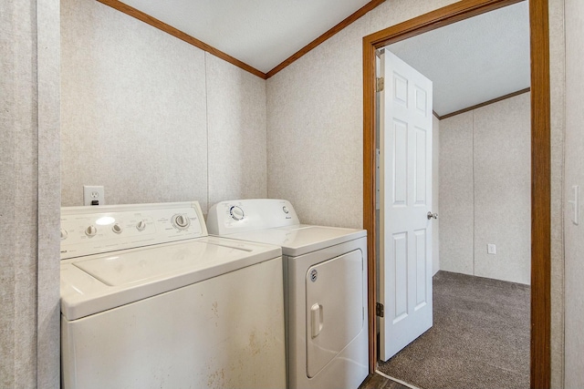 laundry area with separate washer and dryer, dark carpet, and ornamental molding