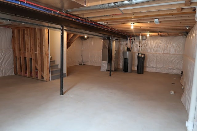 basement featuring heating unit and water heater