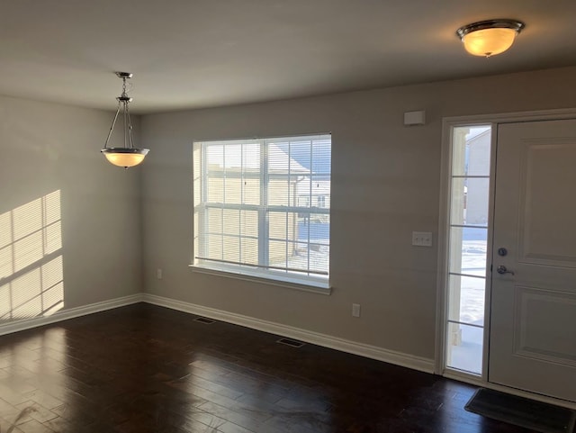 foyer entrance featuring dark hardwood / wood-style flooring