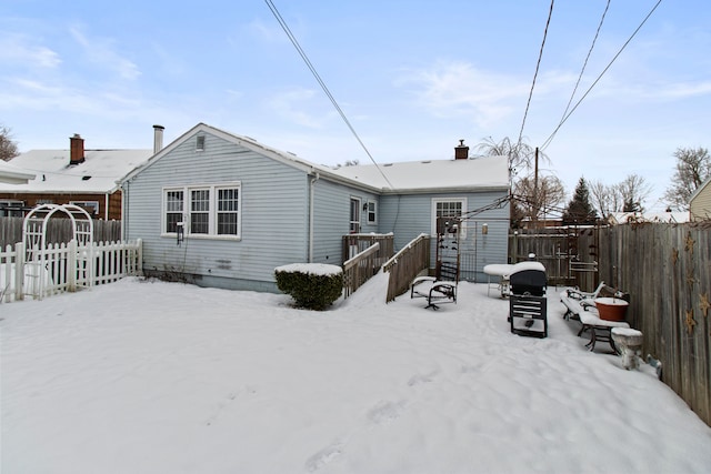 view of snow covered house