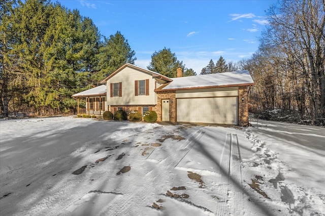 view of front of property featuring a garage and covered porch