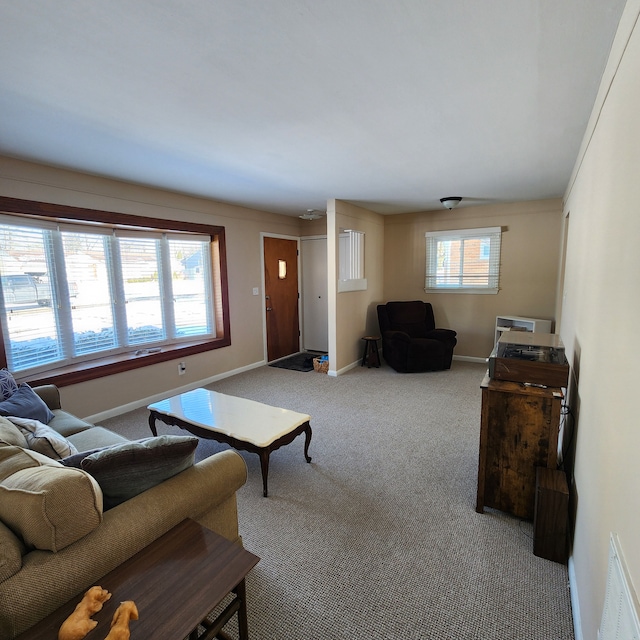 carpeted living room featuring a healthy amount of sunlight