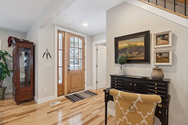 entryway with light hardwood / wood-style flooring