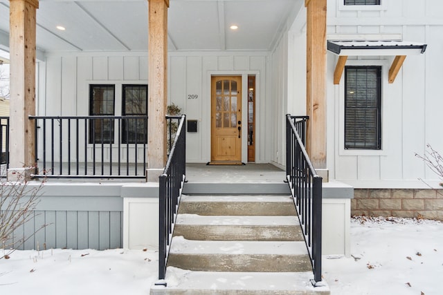 view of snow covered property entrance