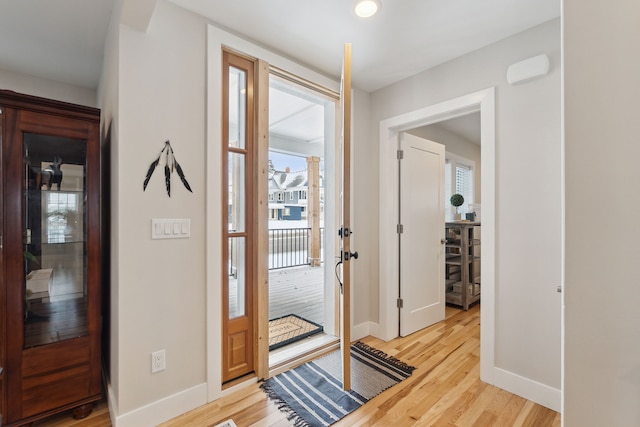 foyer with light wood-type flooring