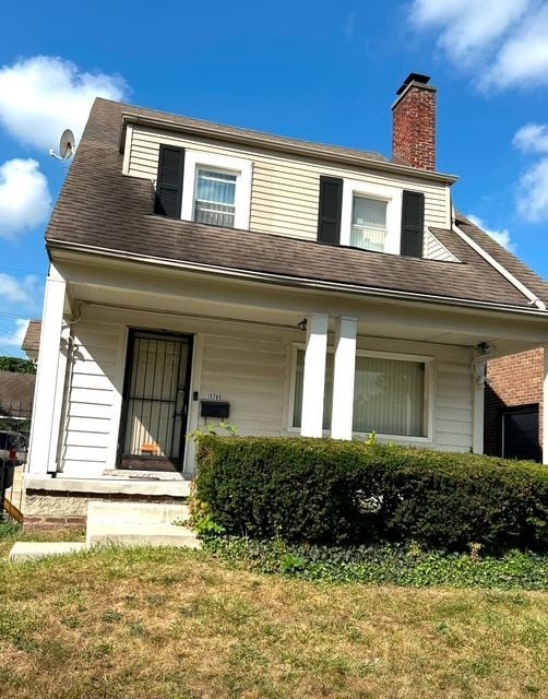 exterior space with a front lawn and covered porch