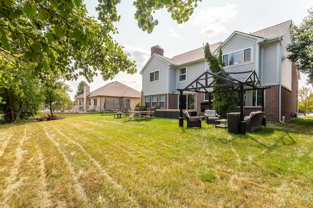 rear view of property with an outdoor hangout area and a yard