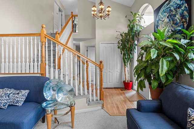 foyer entrance featuring lofted ceiling and a chandelier