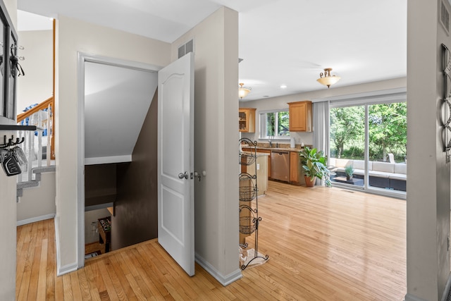 hall with light hardwood / wood-style floors