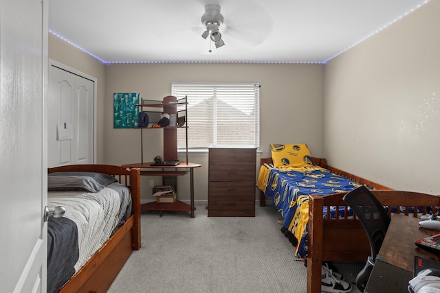 carpeted bedroom with ceiling fan