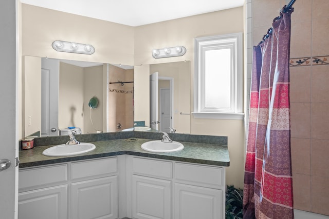 bathroom featuring vanity and a shower with shower curtain