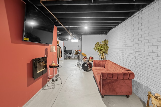 basement featuring brick wall