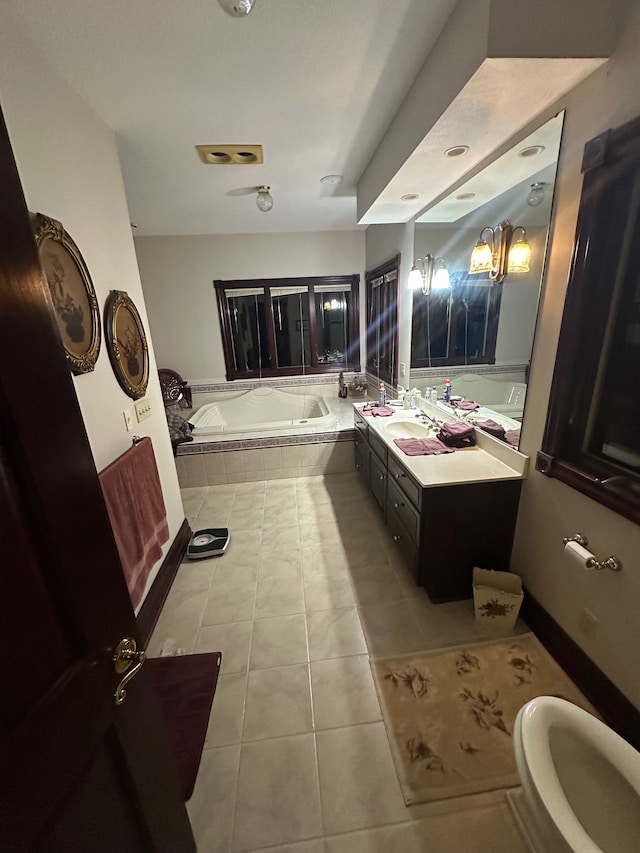 bathroom featuring vanity, tiled bath, and tile patterned floors