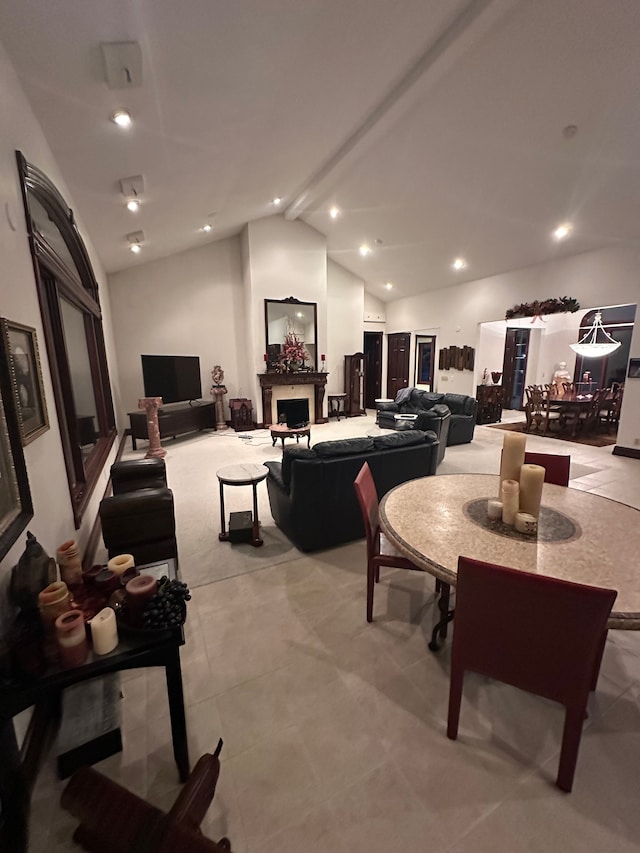 dining space featuring lofted ceiling with beams