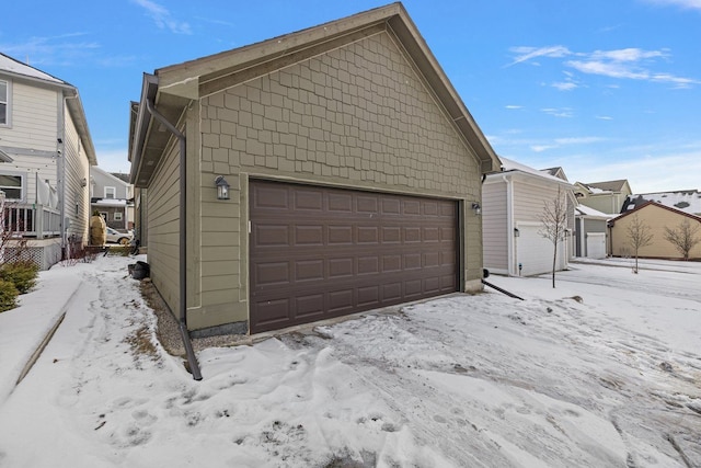 view of snow covered garage